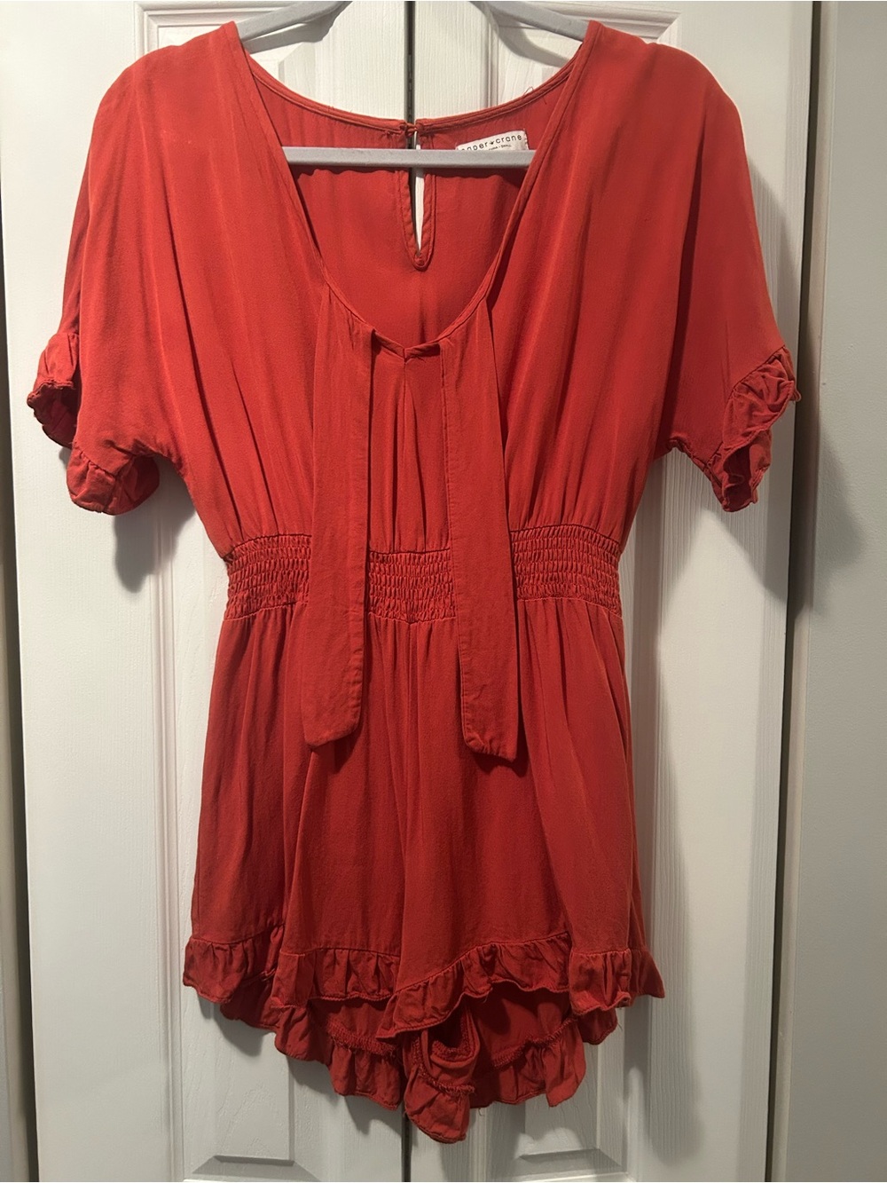Paper Crane Coral Tie-Neck Smocked Romper with Ruffle Trim